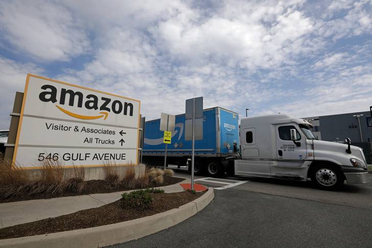 An Amazon truck drives out of the Amazon's Staten Island fulfillment center, April 24, 2022.
